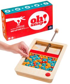 a wooden toy with an open box and colorful beads