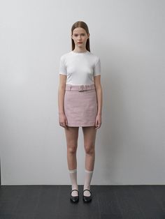 This product, the Janie Belted Skirt, is designed to offer a sleek and stylish addition to any fashion-forward wardrobe. The skirt's A-line cut is flattering on a variety of body types, and the included belt cinches at the waist for an added touch of elegance. With its clean lines and minimalist design, this skirt is a versatile piece that can be dressed up or down. - The Janie Belted Skirt features an A-line cut that gracefully complements the figure.- It comes with a matching belt that highlights the waist and adds a sophisticated detail.- The skirt is secured with a discreet back zipper, allowing for a seamless and comfortable fit.- Constructed with a smooth, lightweight fabric, it provides a comfortable wear suitable for different seasons. Belted Fitted Mini Skirt, Fitted Belted Mini Skirt, Fitted Mini Skirt With Belt, Elegant Belted Skort, High Waist Fitted Belted Skort, Chic Fitted Skirt With Belt, Chic Mini Skirt With Belt Detail For Work, Fitted Mini Skirt With Belt Detail, Belted Mini Length Bottoms For Workwear