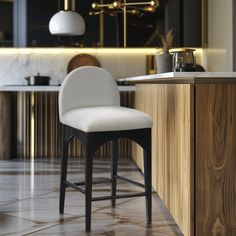 a white bar stool sitting in front of a counter top next to a wooden cabinet