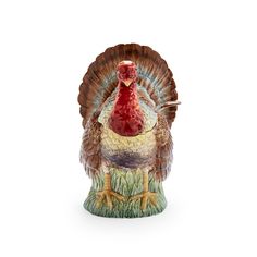 a turkey figurine sitting on top of a table