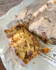 two pieces of cake sitting on top of a white plate with frosting over them