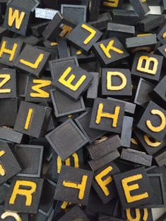 black and yellow typewriters are scattered together