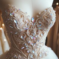 the back of a wedding dress with beading and sequins