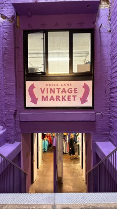 a purple building with a sign that says brick lane vintage market