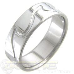 a wedding ring with an unusual design on the outside and inside, in white gold