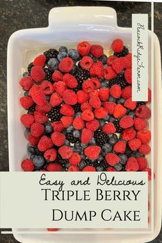 an easy and delicious triple berry dump cake with berries in the middle is ready to be eaten