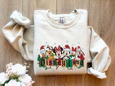 Retro Mickey and Friends Christmas Sweatshirt, Vintage Disneyland Christmas Sweatshirt, Disneyland Sweatshirt, Christmas Family Matching Welcome to Bee Design Gifts If you are looking for soft, comfy, first-rate sweatshirts, you're in the right place! I love what I do and strive to make your shopping experience just right for you. If you have any questions, concerns or comments about my products, feel free to send a message anytime. ⭐ 50% cotton, 50% polyester ⭐ Pre-shrunk ⭐Classic fit ⭐ 1x1 athletic rib knit collar with spandex ⭐ Air-jet spun yarn with a soft feel and reduced pilling ⭐Double-needle stitched collar, shoulders, armholes, cuffs, and hem HOW TO PLACE ORDER 1. Check photos for size chart, model comparison and color options 2. Select size and color from the drop down options 3. Disney Shirt Christmas, Family Disney Shirts Christmas, Disney Christmas Sweatshirt, Christmas Disney Sweaters, Disneyland Christmas Sweater, Disney Xmas Sweaters, Christmas Disney Outfits, Disneyland Christmas Outfit, Disneyland Vintage