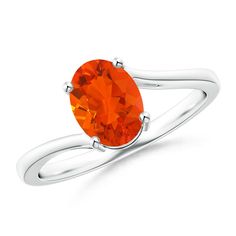 an orange topazte ring on a white background