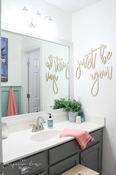 a bathroom sink with a mirror above it and the words do today, just be you on the wall