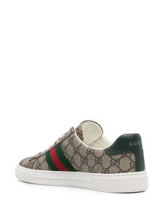 Find GUCCI Ace Panelled Sneakers on Editorialist. beige panelled design GG Supreme canvas signature Web detailing contrasting branded heel counter round toe front lace-up fastening branded leather insole flat rubber sole This piece comes complete with a protective dust bag. Women's Gucci sneakers fit large. For the most comfortable fit please select half a size down. We've partnered with Good On You — an independent agency that rates how brands perform in relation to their impact on the planet, Luxury Lace-up Sneakers With Logo Detail, Green Leather Sneakers With Logo Print, Gucci Low-top Sneakers With Logo, Designer Logo Lace-up Sneakers, Gucci Low-top Luxury Sneakers, Gucci Luxury Sneakers With Branded Insole, Gucci Luxury Sneakers With White Sole, Luxury Gucci Sneakers With White Sole, Designer Logo Print Sneakers With Round Toe