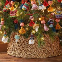 a christmas tree decorated with tassels and lights