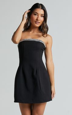 Step into the spotlight and let your style shine with our Arabella Mini Dress! This strapless, diamante trim structured dress in black is perfect for those party nights where you want to make a statement. Made from a combination of viscose and nylon, this shift dress hugs your curves in all the right places while still allowing you to dance the night away. Whether you're hitting the club or attending a special event, our Arabella Mini Dress will have heads turning wherever you go. So step out in Black Hoco Dress Short, Christmas Dance Dresses, Hoco Dress Short, Winter Dance Dresses, Black Hoco Dresses, Purple Formal Dress, Sadies Dress, Semi Dresses, Black Homecoming Dress