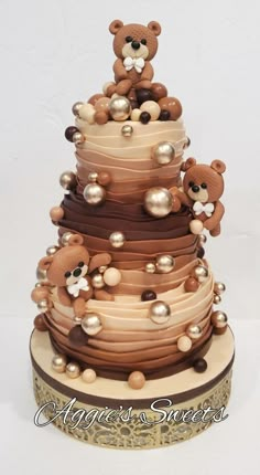 a teddy bear is sitting on top of a cake with pearls and pearls around it