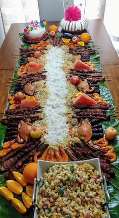 a table topped with lots of different types of food