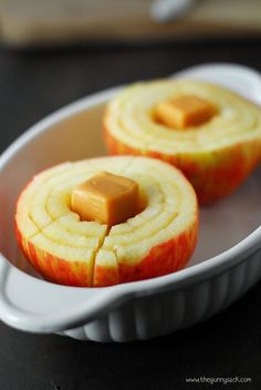 an apple sliced in half and sitting in a bowl