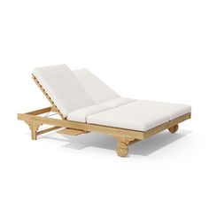 a wooden chaise lounge chair with white cushions