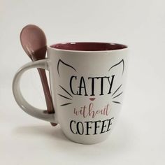 a coffee cup with a spoon in it and the words catty without coffee written on it