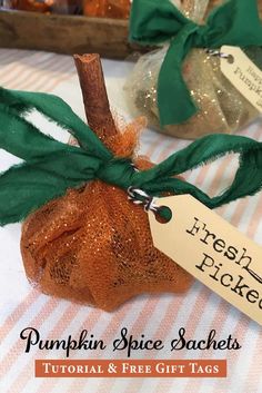 pumpkin spice sachets with green ribbon tied around them