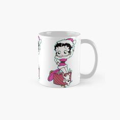 a cartoon character on a white mug with pink and green accents, wearing a santa claus hat