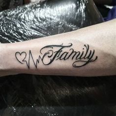 a tattoo with the word family written on it's arm and heart in the middle