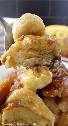 a close up of food on a plate with a spoon