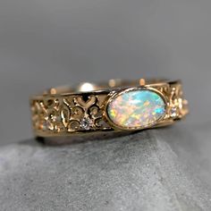 a gold ring with an opal in the center