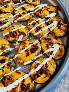 baked potatoes with cheese and sauce in a pan