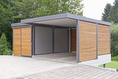 an outdoor storage shed with two doors open