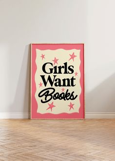 a pink and white sign that says girls want books on the side of a wall