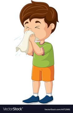 a young boy blowing his nose with a tissue paper in front of him on a white background