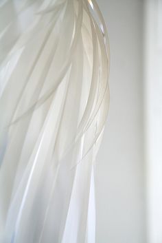 a close up view of a light fixture in a room with white walls and flooring