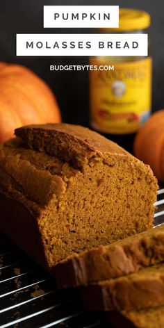 pumpkin molasse bread is sliced and sitting on a cooling rack