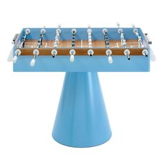 a blue table top foosball sitting on top of a metal base with white knobs