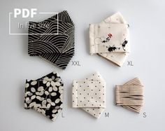 four pieces of cloth laid out on top of each other in different sizes and shapes