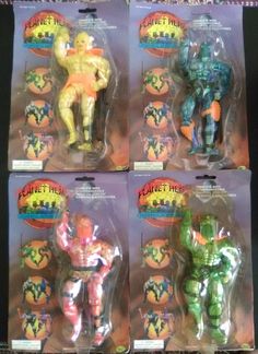 four action figures in plastic packaging on display