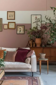 a living room filled with furniture and lots of plants