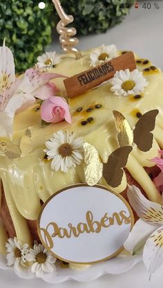 there is a cake with flowers on the top and an inscription on the side that says paradise