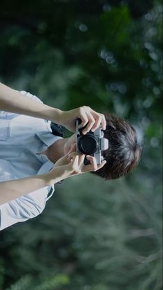 a woman taking a photo with her camera