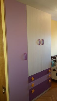 a bedroom with purple, white and yellow walls