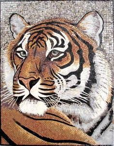 a close up of a tiger's face on a mosaic wall