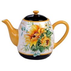 a tea pot with sunflowers painted on it