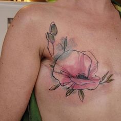 a man with a flower tattoo on his chest