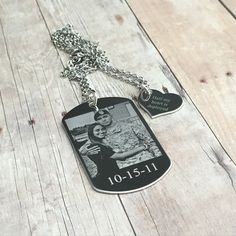 a dog tag with an image of a man and woman on it is attached to a chain