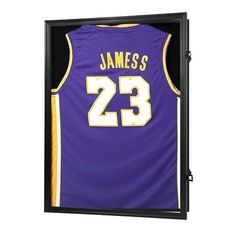 a purple and yellow jersey in a black shadow box with the number 23 on it