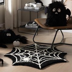 a black and white spider rug with eyes on it