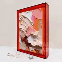 a red frame with some screws and paint on it