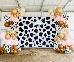 Cowgirl theme balloon arch with cow backdrop and happy birthday neon sign. Cow Print Photo Backdrop, Cow Theme Balloon Arch, Cowgirl Backdrop Ideas, Cow Print 21st Birthday, Highland Cow Balloon Arch, Cow Themed Birthday Party Decoration, Cow Print Birthday Party Ideas, Western Balloon Arch, Cowgirl Balloon Arch