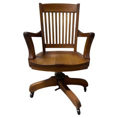 a wooden office chair with wheels on an isolated white background