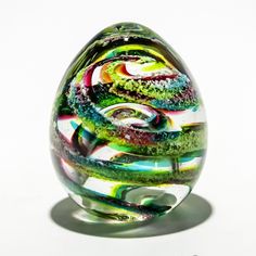 ocean colorful egg with cremation ashes Glass Eggs, Eggs In Heaven Michael Symon, Memorial Glass Ashes, Pink Faberge Egg, Acrylic Keepsakes, Crystal Egg, Crystal Resin, Cat Flowers, Cremation Ashes