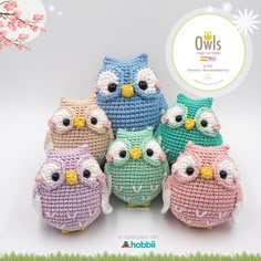 four crocheted owls sitting next to each other in front of a white background